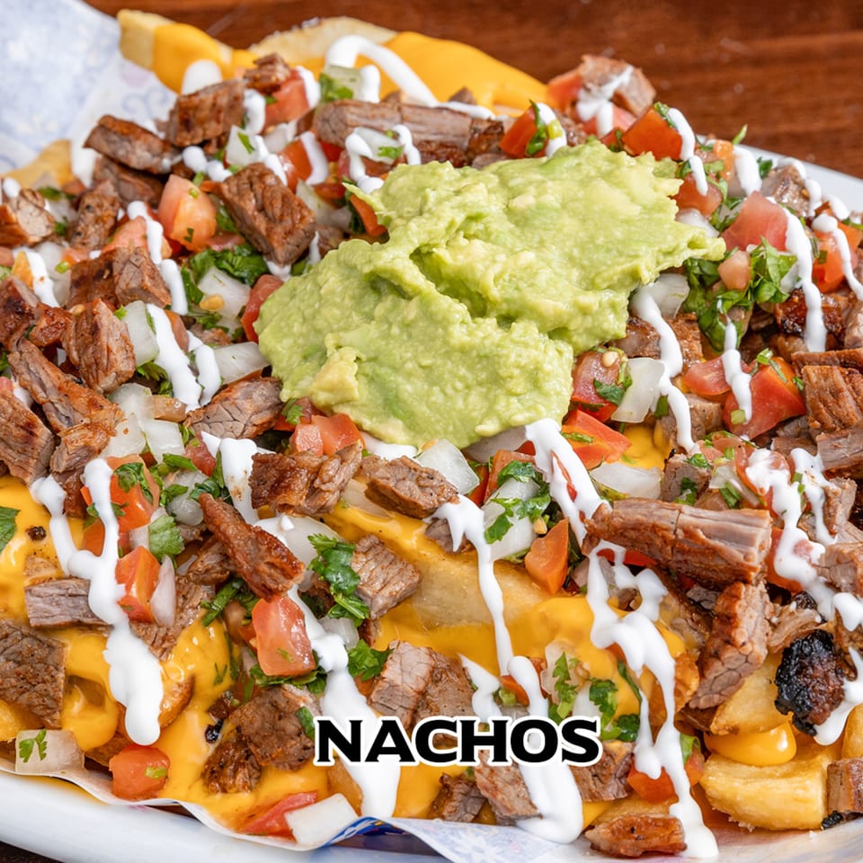 House of Tacos Grill's carne asada nachos with cheese, pico de gallo, sour cream, and guacamole.
